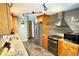 Modern kitchen with stainless steel appliances, granite countertops, and ample cabinet space at 41 Young Ave, Englewood, FL 34223
