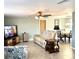 Inviting living room with tile flooring, neutral paint, and a comfortable seating area at 41 Young Ave, Englewood, FL 34223