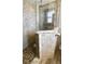 Walk-in shower with stone tiling and pebble floor at 41 Young Ave, Englewood, FL 34223