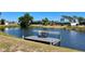 Picturesque waterfront view highlighting a private dock with seating at 41 Young Ave, Englewood, FL 34223