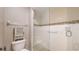 Modern bathroom featuring tiled walk-in shower with glass enclosure, matching tile accents, and updated fixtures at 4201 Center Gate Ln # 1, Sarasota, FL 34233