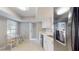 Eat-in kitchen with updated counters, stainless steel appliances, breakfast area, and lots of light from the window at 4201 Center Gate Ln # 1, Sarasota, FL 34233