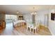 Spacious open floor plan showcasing living room, dining area, and sliding doors to outdoor patio at 4201 Center Gate Ln # 1, Sarasota, FL 34233