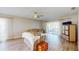 Comfortable living room with wood floors, ceiling fan, sliding glass doors, and neutral color palette at 4201 Center Gate Ln # 1, Sarasota, FL 34233