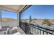 Cozy screened balcony with stylish chairs, providing scenic water views and a tranquil outdoor space at 551 Ranger Ln, Longboat Key, FL 34228