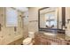 Bathroom showcasing a walk-in shower, granite counters, and modern fixtures at 551 Ranger Ln, Longboat Key, FL 34228