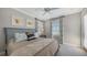 Comfortable bedroom showcasing a cozy bed, decorative pillows, and serene wall art at 551 Ranger Ln, Longboat Key, FL 34228