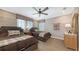 Comfortable bedroom featuring two beds, a ceiling fan, and neutral decor at 551 Ranger Ln, Longboat Key, FL 34228