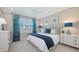 Bright bedroom with a queen bed, stylish curtains, and coordinated decor at 551 Ranger Ln, Longboat Key, FL 34228