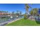 A private dock area leads from the backyard to the waterway, with room for seating and entertaining at 551 Ranger Ln, Longboat Key, FL 34228
