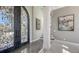 Foyer with an ornate front door, decorative accents, and access to the staircase at 551 Ranger Ln, Longboat Key, FL 34228