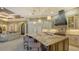Spacious kitchen with a large island, perfect for entertaining, with access to living area at 551 Ranger Ln, Longboat Key, FL 34228