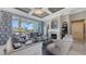 Inviting living room with a fireplace, custom ceiling, and comfortable seating arrangement at 551 Ranger Ln, Longboat Key, FL 34228