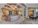 A living room showcases a luxurious interior design and seamless indoor-outdoor living with access to the patio at 551 Ranger Ln, Longboat Key, FL 34228