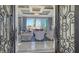 Living room with elegant decor, comfortable seating, and access to a beautiful outdoor view at 551 Ranger Ln, Longboat Key, FL 34228