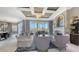 Open-concept living room with stylish furnishings, elegant finishes, and ample natural light at 551 Ranger Ln, Longboat Key, FL 34228
