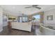 Expansive living room with views, comfortable seating, a glass table, and a balcony for enjoying outdoor living at 551 Ranger Ln, Longboat Key, FL 34228
