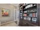 Inviting office space with custom built-in bookshelves, a French door, and stylish decor at 551 Ranger Ln, Longboat Key, FL 34228