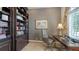 Well-appointed office with custom built-in shelves, a comfortable desk, and a window view at 551 Ranger Ln, Longboat Key, FL 34228