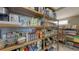 Walk-in pantry with open shelving and ample storage space for food and kitchen essentials at 551 Ranger Ln, Longboat Key, FL 34228