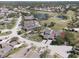 Stunning aerial shot showcases a home near a golf course and tranquil ponds at 5604 Doral Dr, Sarasota, FL 34243