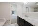 View from bathroom with marble countertop vanity and stylish fixtures to bedroom at 5604 Doral Dr, Sarasota, FL 34243