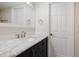 Bathroom with a marble countertop vanity and stylish fixtures at 5604 Doral Dr, Sarasota, FL 34243
