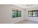 Bedroom featuring large windows with a view at 5604 Doral Dr, Sarasota, FL 34243