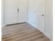 Bright foyer with hardwood floors and double doors at 5604 Doral Dr, Sarasota, FL 34243