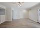 Bright living room features wood-look flooring, neutral paint, and a ceiling fan at 5604 Doral Dr, Sarasota, FL 34243