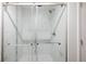 Modern shower features glass doors, a rainfall shower head, and stylish tile at 5604 Doral Dr, Sarasota, FL 34243