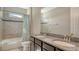 Bathroom featuring double sinks, granite countertops, a large mirror and a shower/tub combo at 5723 Title Row Dr, Bradenton, FL 34210