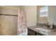 Bathroom with tiled walk-in shower, granite countertop, and sink at 5723 Title Row Dr, Bradenton, FL 34210