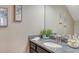 Bathroom featuring granite countertops, framed mirror, and decorative accessories at 5723 Title Row Dr, Bradenton, FL 34210