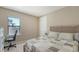 Cozy bedroom with a comfortable bed, a desk, and natural light from the window at 5723 Title Row Dr, Bradenton, FL 34210