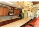 Clubhouse bar featuring granite countertop, stainless steel appliances, bar seating and cabinets at 5723 Title Row Dr, Bradenton, FL 34210