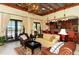Inviting clubhouse interior with bar, seating, and access to outdoor amenities at 5723 Title Row Dr, Bradenton, FL 34210
