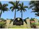Entrance sign for Legends Bay at IMG Academies, framed by lush greenery and palm trees at 5723 Title Row Dr, Bradenton, FL 34210