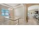 Dining room with modern chandelier, tile floors, and sunlit windows at 5723 Title Row Dr, Bradenton, FL 34210
