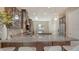 Bright kitchen featuring granite counters, stainless steel appliances, breakfast bar, and dark cabinets at 5723 Title Row Dr, Bradenton, FL 34210