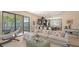 Spacious living room with an open layout, seamlessly connected to the kitchen and patio at 5723 Title Row Dr, Bradenton, FL 34210