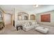 Cozy upstairs living room featuring neutral walls, carpet, and a plush sofa at 5723 Title Row Dr, Bradenton, FL 34210