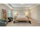 Spacious main bedroom with tray ceiling and luxurious furniture at 5723 Title Row Dr, Bradenton, FL 34210