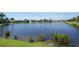 Picturesque community pond with fountains and lush landscaping, creating a serene environment at 5723 Title Row Dr, Bradenton, FL 34210