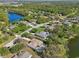 A peaceful, wooded neighborhood featuring single-Gathering homes and a tranquil lake for scenic views and outdoor enjoyment at 610 147Th St E, Bradenton, FL 34212
