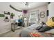 Bright bedroom with a desk, computer, and window with plenty of natural light at 610 147Th St E, Bradenton, FL 34212