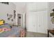 Cozy bedroom with a closet, decorative wall art, and a door leading to the bathroom at 610 147Th St E, Bradenton, FL 34212