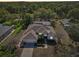 Well-maintained home featuring a two-car garage, a lush garden, and a screened-in porch at 610 147Th St E, Bradenton, FL 34212