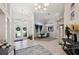 Bright, high-ceiling foyer that connects to a dining room with decorative accents at 610 147Th St E, Bradenton, FL 34212