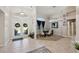 Bright, high-ceiling foyer and dining room, featuring tile flooring throughout at 610 147Th St E, Bradenton, FL 34212
